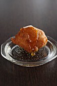 Oliebollen (deep fried pastry, Netherlands) with almonds and honey