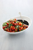 Tomato salad with fresh herbs and pomegranate seeds