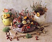 An autumnal arrangement featuring a wicker wreath, mushrooms, mosse and berrie