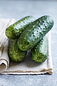 Fresh cucumbers on a linen cloth