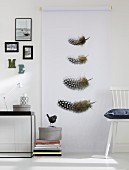 Guinea fowl feathers printed on roll of paper as wall decoration