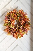 Wreath of autumn leaves on door