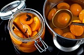 Apricot compote in a jar and in a pot