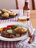 Rump steak with herb butter, fried vegetables and baked potatoes (USA)