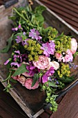 Bouquet of freshly picked, cottage-garden flowers (mallow, lady's mantle, catmint)