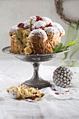 Stollen with cranberries on a cake stand