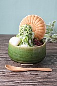 Matcha shaved ice with a Japanese wafer