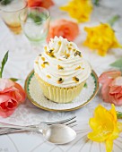 A passion fruit cupcake with butter cream