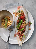 Stuffed oven-roasted sole with croutons, shrimps, cherry tomatoes and herbs