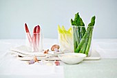 An arrangement of asparagus, lettuce, mushrooms and mayonaisse
