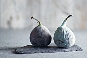 Two figs on a piece of slate