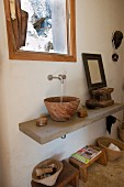 Wooden sink and wooden footstool under masonry washstand