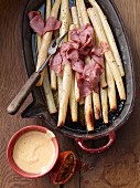 Oven-roasted black salsify with anise and blood orange Hollandaise sauce