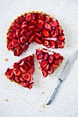 Strawberry tart with two slices cut out