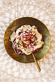 A duo of pasta: spaghetti and beetroot tagliatelle (seen from above)