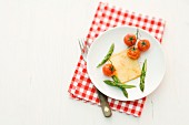Raclette with asparagus and tomatoes