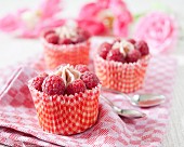 Cupcakes topped with raspberries