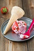 Strawberry ice cream with chopped hazelnuts