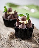 Cupcakes decorated with mint chocolate and Malteasers