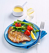 Snapper fillet with asparagus and tomatoes