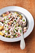 Seafood salad with red onions, parsley, lemon and olive oil