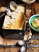 Caramel ice cream in mould and small bowl