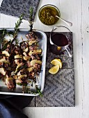 Pork kebabs with anchovy sauce