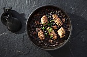 Calamari on black beans (seen from above)