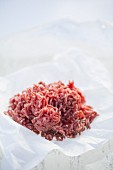 Fresh minced meat on a piece of paper