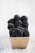 Blackberries in a cardboard container