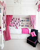 Girl's bedroom in white, pink and black with cubby bed