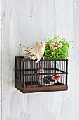 Bird ornaments hand-crafted from tin foil and paper strips as spring decoration