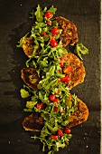 Almond-coated turkey chops with a rocket and tomato salad