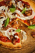 Pizza with Italian sausage, fennel and basil