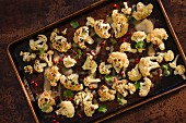 Oven-baked cauliflower with pineapple seeds and tahini