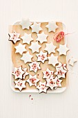 Cinnamon stars on baking paper (seen from above)