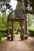 Round pavilion with wrought iron, lattice cupola in gardens of Villa Cimbrone