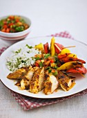 Peri-peri chicken with a pepper skewer and rice