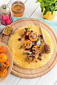 Chickpea crêpes with grilled apricots, honey and tahini