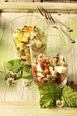 Cheese salad with edible flowers and wild herbs
