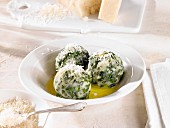 Spinach dumplings with Parmesan and melted butter