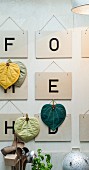 Letter signs and homemade potholders as wall decoration