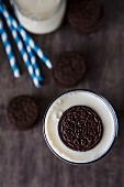 An Oreo cookie in a glass of milk (seen from above)
