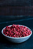 A bowl of pink peppercorns