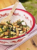 Mediterranean vegetable salad in a colourful enamel bowl