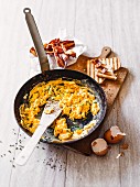 Classic scrambled eggs with bacon and toast