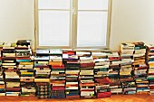 Books stacked below window