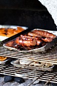 Grilled sausage and vegetables on a barbecue