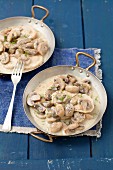 Braised pork loin with mushrooms in a creamy sauce