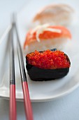 Sushi with salmon caviar and salmon